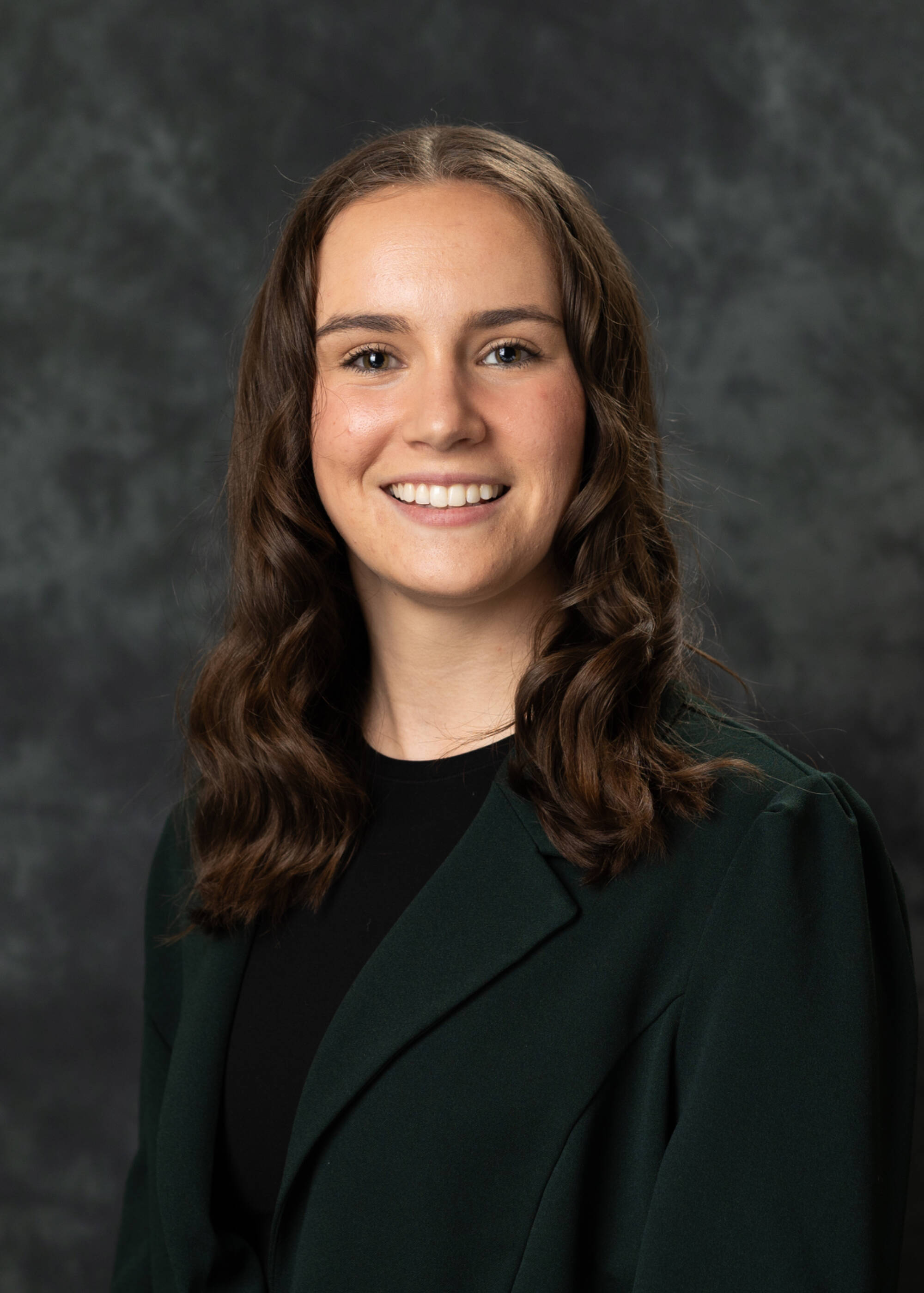 Sadie McCann smiling in a black top